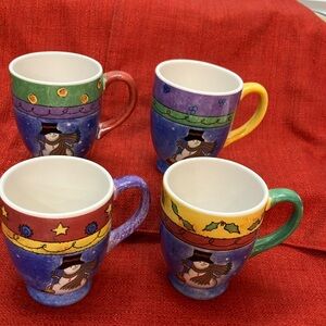 4 Sango Sweet Shoppe Christmas Mugs 16 oz. Like new.